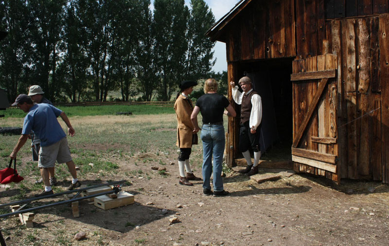 Director Trygve Lode goes over the scene with Steve Austin and Macleish Day