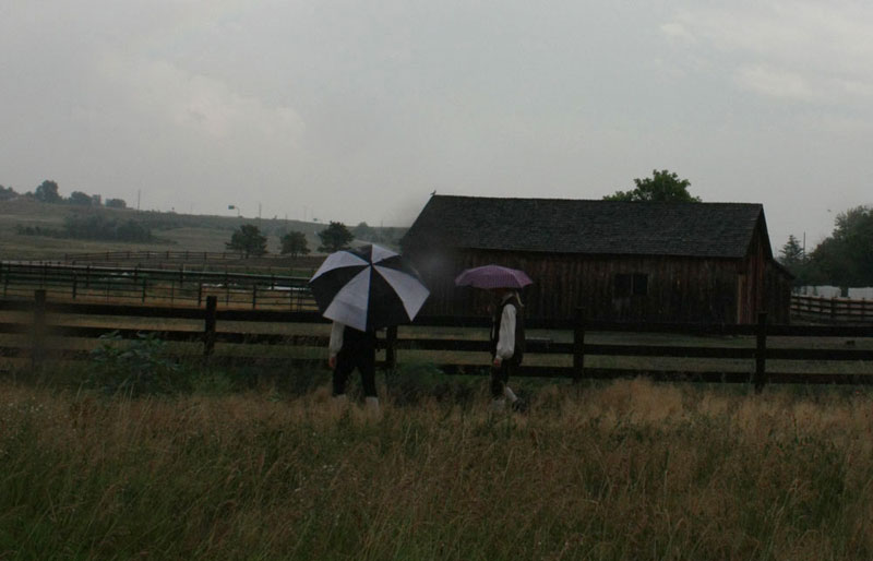 Macleish Day and Ben Kroger walk to their places in the rain.