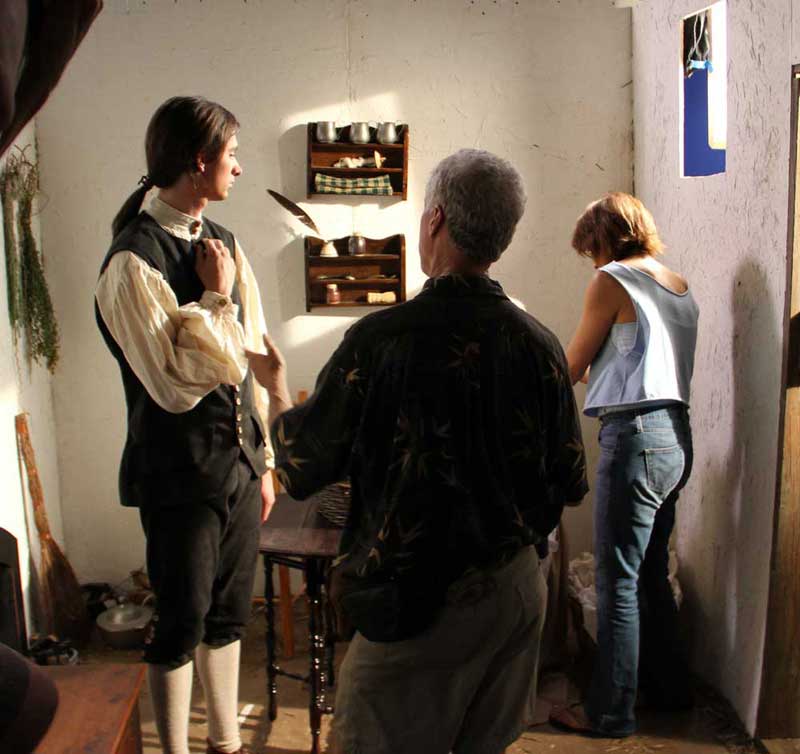 DP Ed Done discusses the shot with actor Macleish Day while Key Make up artist Lorraine Altamura touches up June Polner.