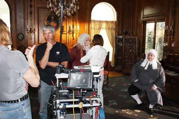 Director Trygve Lode talks to soundman Dave Schaaf as Lorraine touches up Don Kraus and T David waits