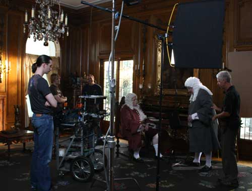 Macleish Day (left) watches as the camera crew works with the actors in the scene.