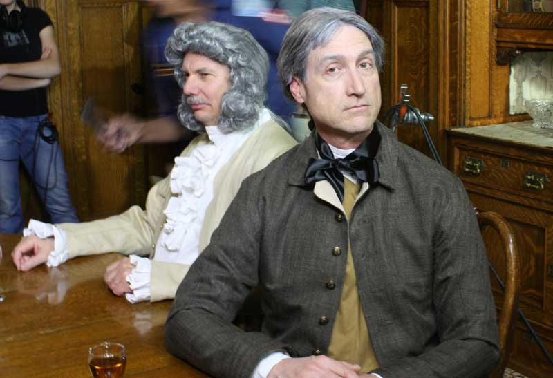 Andy Hankins in costume as Matthew Berkshire, a wealthy landowner and John Arthur Neal behind him dressed as Samuel Wilfram, the miller.