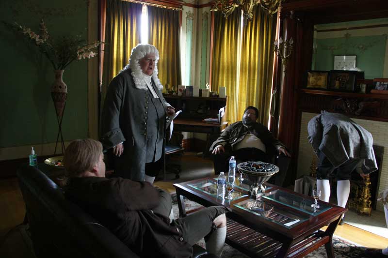 Actors T David Rutherford, Tom Doyle, Steve Austin and Michael Kempton wait in another room while the crew moves the dolly tracks.