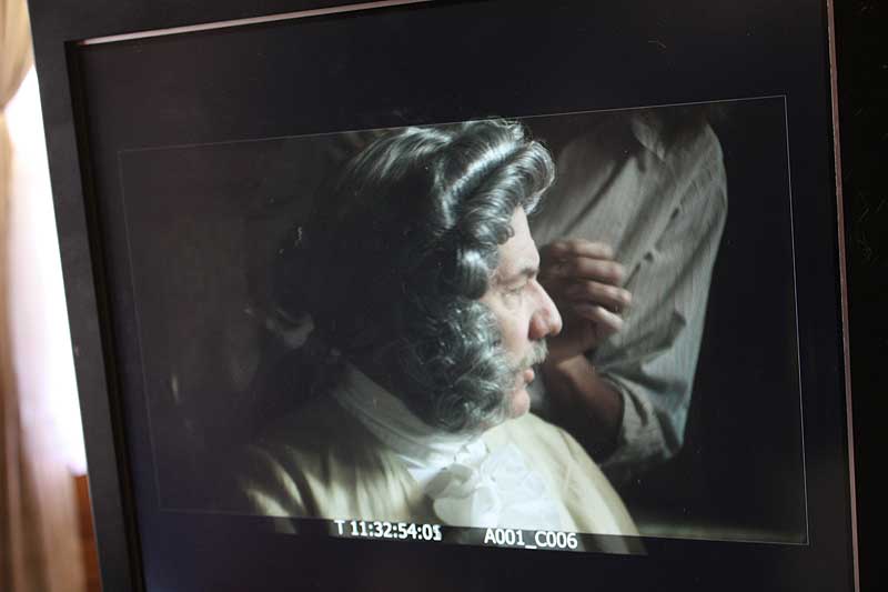 View in the camera monitor of Lorraine Altamura touching up John Arthur Neal's make up before his close up.